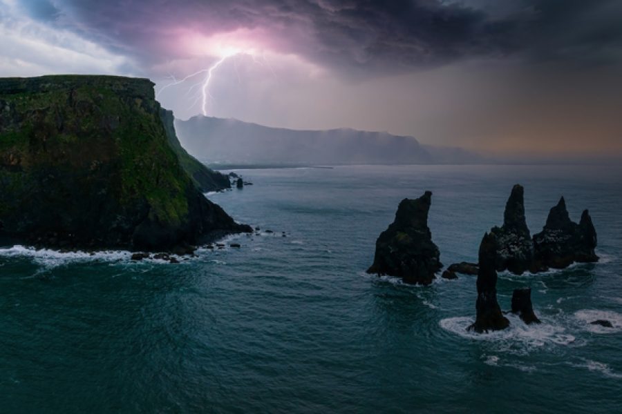 Iceland black sand beach with huge waves at Reynisfjara Vik. Aerial cinematic 4k video. Beautiful Iceland nature coastline from above.