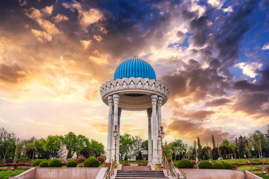 landmark monument Patriots Memorial white rotunda with a blue dome in the park in spring in Tashkent in Uzbekistan