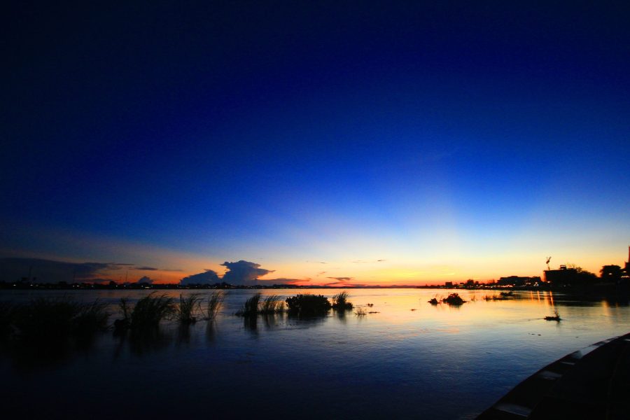 Beautiful silhouette Sunrise and sunset  is twilight on the sky and reflections in the Mekong River at Vientiane Province, LAOS