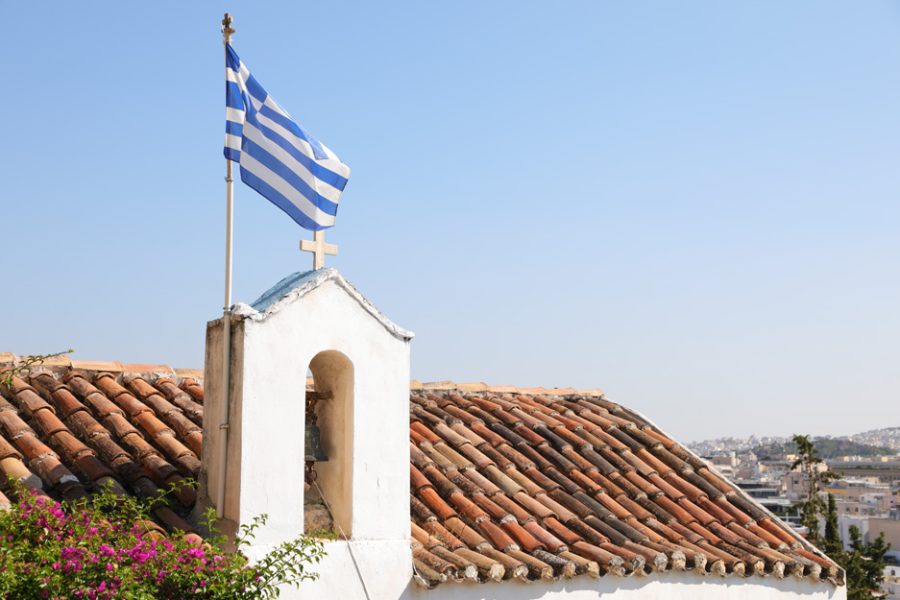 vecteezy_greek-flag-waving-over-the-city-of-athens-greece_3407736