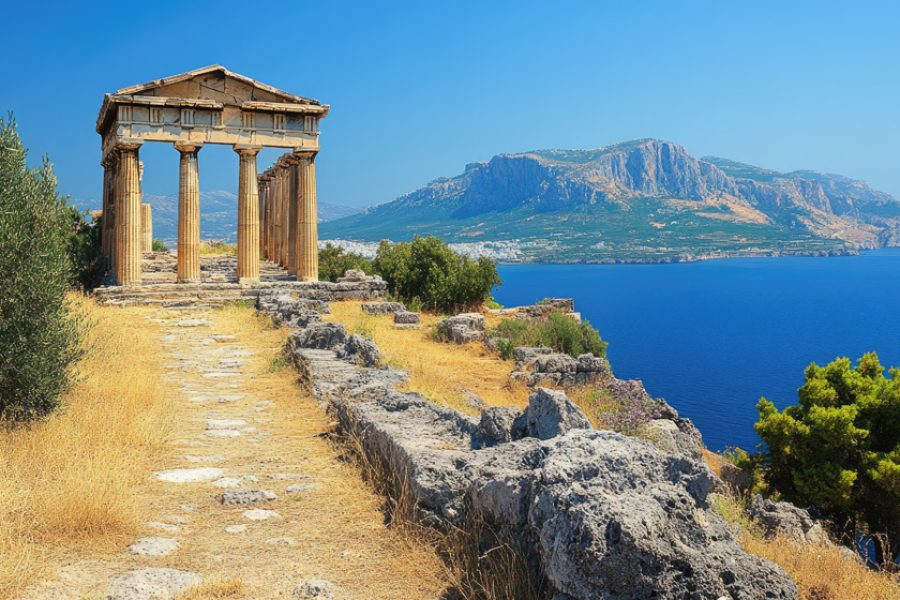 Scenic view of the temple of poseidon at cape sounion overlooking the aegean sea on a sunny day